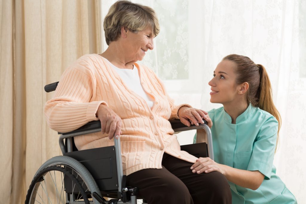 Health care worker comforting a patient